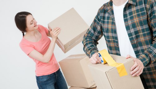 Packed boxes and furniture prepared for a house move in Kingston