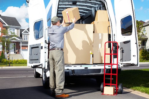 Professional movers loading furniture for a local Kingston home move