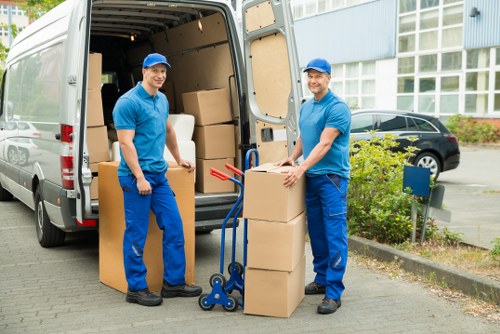 Driver reviewing a service booking and moving equipment