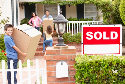 Careful loading of bulky household furniture into a removals van